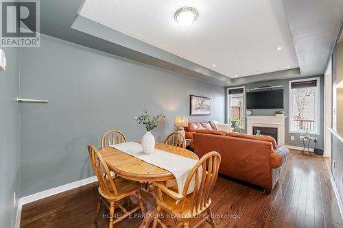 4168 Judson Common, Burlington, ON - Indoor Photo Showing Dining Room With Fireplace