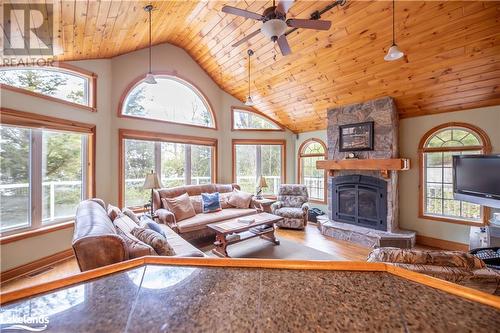 From kitchen to great room - 1016 Pegg Drive, Haliburton, ON - Indoor Photo Showing Living Room With Fireplace