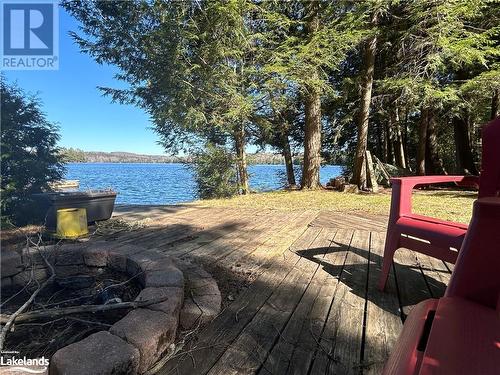 Lakeside fire pit - 1016 Pegg Drive, Haliburton, ON - Outdoor With Body Of Water With View