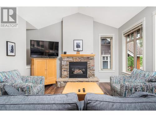 251 Predator Ridge Drive Unit# 12, Vernon, BC - Indoor Photo Showing Living Room With Fireplace