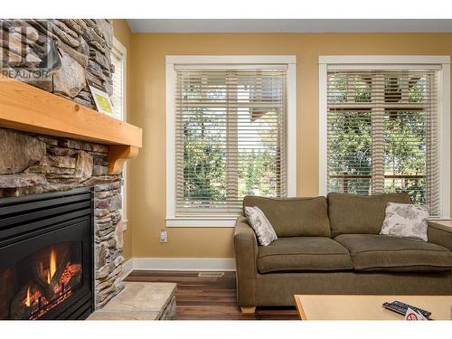 251 Predator Ridge Drive Unit# 47, Vernon, BC - Indoor Photo Showing Living Room With Fireplace