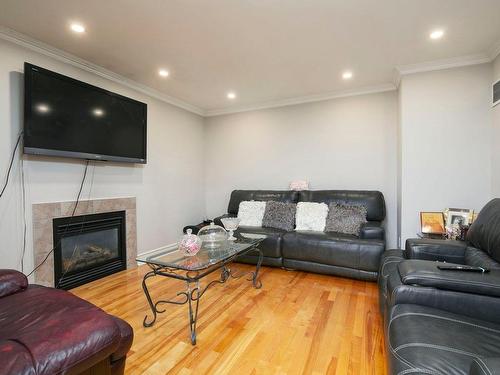 Salle familiale - 1069 Rue Des Crocus, Laval (Sainte-Dorothée), QC - Indoor Photo Showing Living Room With Fireplace