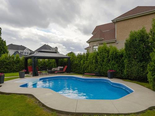 Piscine - 1069 Rue Des Crocus, Laval (Sainte-Dorothée), QC - Outdoor With In Ground Pool With Backyard