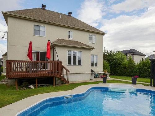 Face arriÃ¨re - 1069 Rue Des Crocus, Laval (Sainte-Dorothée), QC - Outdoor With In Ground Pool With Deck Patio Veranda