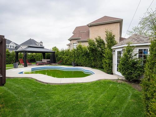 Cour - 1069 Rue Des Crocus, Laval (Sainte-Dorothée), QC - Outdoor With In Ground Pool With Backyard