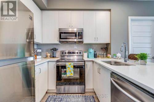 127 - 1105 Leger Way, Milton, ON - Indoor Photo Showing Kitchen With Double Sink With Upgraded Kitchen