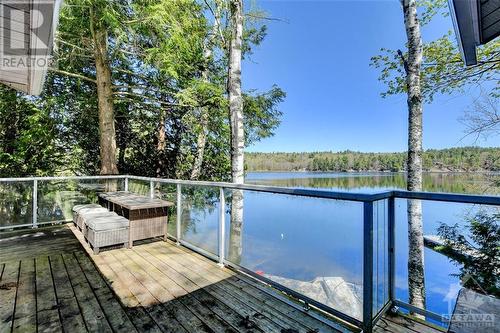 Large outdoor dining area with captivating views - 365 Yvon Lane, Westport, ON - Outdoor With Body Of Water With View