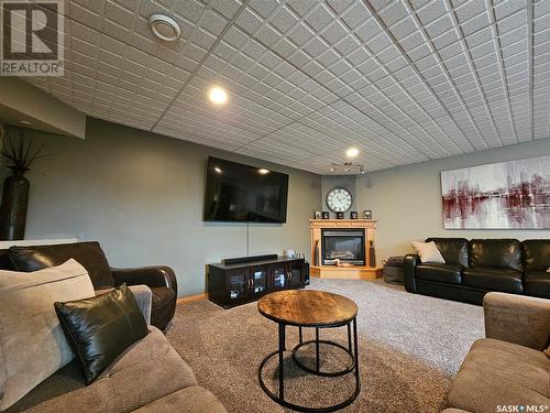 10 Manor Bay, Carlyle, SK - Indoor With Fireplace