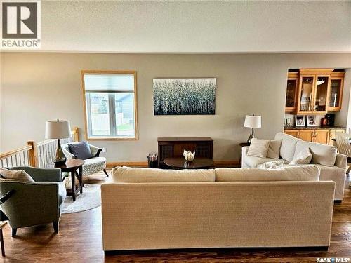 10 Manor Bay, Carlyle, SK - Indoor Photo Showing Living Room With Fireplace