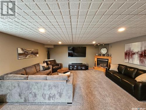 10 Manor Bay, Carlyle, SK - Indoor Photo Showing Other Room With Fireplace