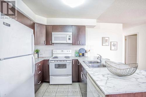 304 - 7405 Goreway Drive, Mississauga, ON - Indoor Photo Showing Kitchen With Double Sink