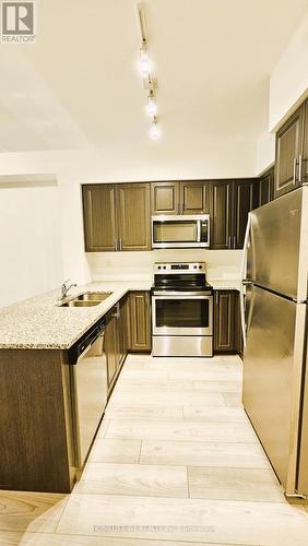 215 - 510 Kingbird Grove, Toronto, ON - Indoor Photo Showing Kitchen With Stainless Steel Kitchen With Double Sink