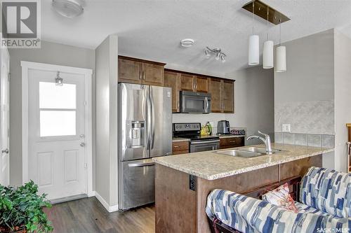 503 3440 Avonhurst Drive, Regina, SK - Indoor Photo Showing Kitchen With Stainless Steel Kitchen With Double Sink