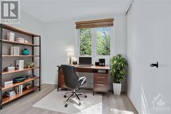 3rd bedroom virtually staged as an office. - 