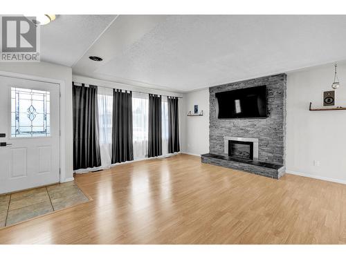 322 Nicholson Street, Prince George, BC - Indoor Photo Showing Living Room With Fireplace