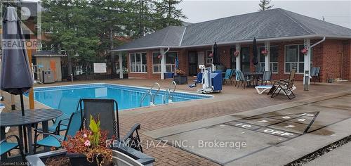 204 - 1 Heritage Way, Kawartha Lakes, ON - Outdoor With In Ground Pool With Deck Patio Veranda