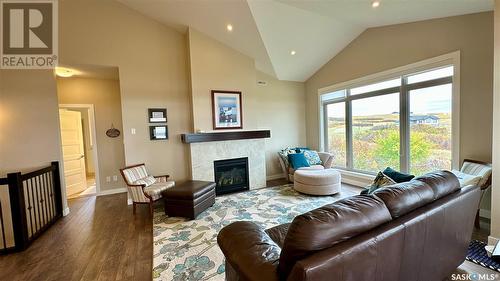 28 Kiiswa Ridge, Sun Dale, SK - Indoor Photo Showing Living Room With Fireplace