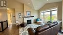 28 Kiiswa Ridge, Sun Dale, SK  - Indoor Photo Showing Living Room With Fireplace 