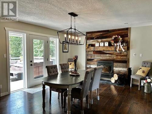 1482 Maple Crescent, Vanderhoof, BC - Indoor Photo Showing Dining Room With Fireplace