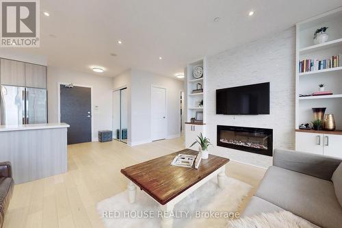 3505 - 33 Shore Breeze Drive, Toronto, ON - Indoor Photo Showing Living Room With Fireplace