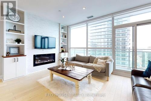 3505 - 33 Shore Breeze Drive, Toronto, ON - Indoor Photo Showing Living Room With Fireplace