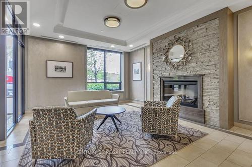 810 - 61 Heintzman Street, Toronto, ON - Indoor Photo Showing Living Room With Fireplace