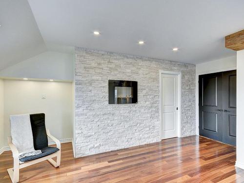 Master bedroom - 115 Rue De La Terre-De-Feu, La Prairie, QC - Indoor With Fireplace