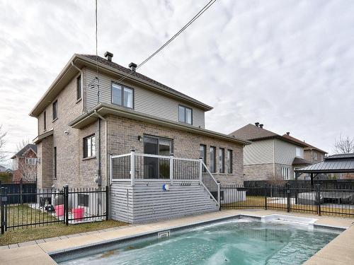 Back facade - 115 Rue De La Terre-De-Feu, La Prairie, QC - Outdoor With In Ground Pool