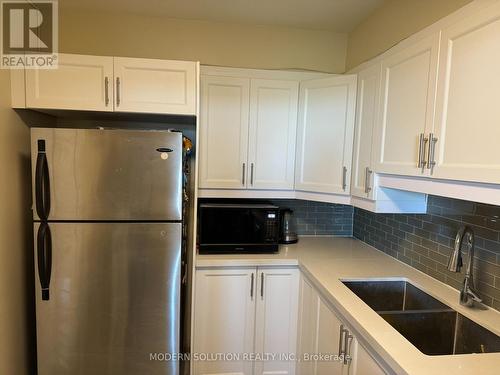 614 - 2550 Pharmacy Avenue, Toronto, ON - Indoor Photo Showing Kitchen With Double Sink