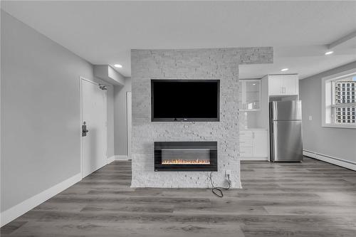 851 Queenston Road|Unit #706, Hamilton, ON - Indoor Photo Showing Living Room With Fireplace