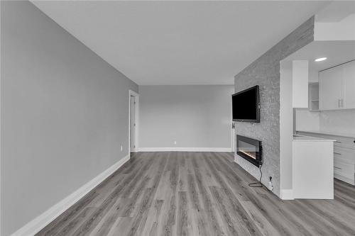 851 Queenston Road|Unit #706, Hamilton, ON - Indoor Photo Showing Other Room With Fireplace
