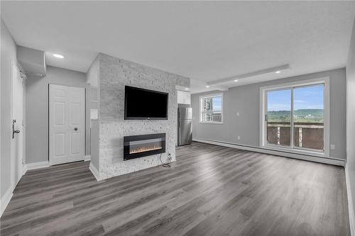 851 Queenston Road|Unit #706, Hamilton, ON - Indoor Photo Showing Living Room With Fireplace