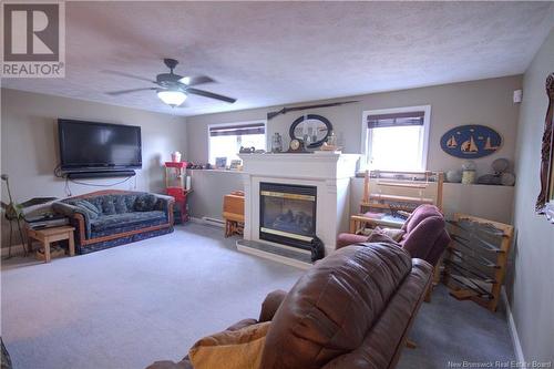 10 Lindsay Lane, Oromocto, NB - Indoor Photo Showing Living Room With Fireplace