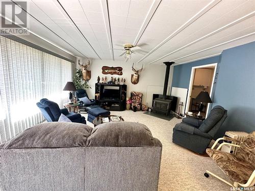 224 Tyndall Place, Chitek Lake, SK - Indoor Photo Showing Living Room With Fireplace