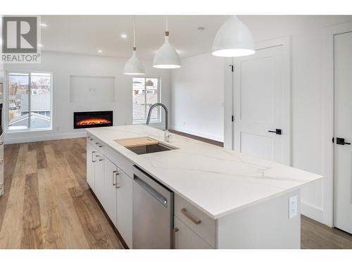 819 Stockwell Avenue Unit# 1, Kelowna, BC - Indoor Photo Showing Kitchen With Fireplace