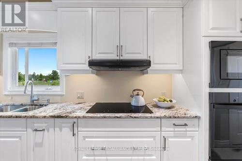 36 Dorchester Drive, Prince Edward County (Wellington), ON - Indoor Photo Showing Kitchen With Double Sink