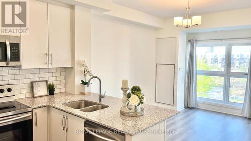 334 - 128 Grovewood Common, Oakville, ON - Indoor Photo Showing Kitchen With Double Sink With Upgraded Kitchen