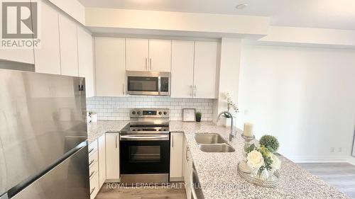 334 - 128 Grovewood Common, Oakville, ON - Indoor Photo Showing Kitchen With Double Sink With Upgraded Kitchen