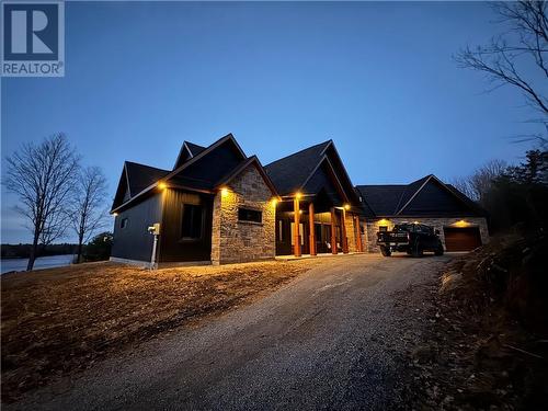 Exterior View At Dusk - 55 Hanlon Bay Road, Elgin, ON - Outdoor