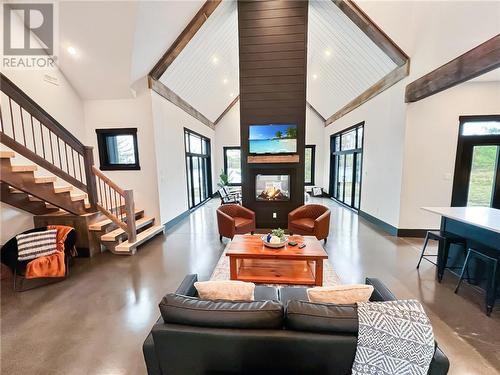 Great Room With Shiplap Gas Fireplace - 55 Hanlon Bay Road, Elgin, ON - Indoor Photo Showing Living Room