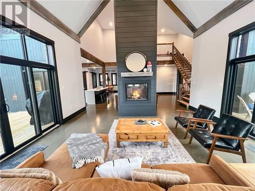 Great Room Centered Around Shiplap Gas Fireplace - 55 Hanlon Bay Road, Elgin, ON - Indoor Photo Showing Living Room With Fireplace