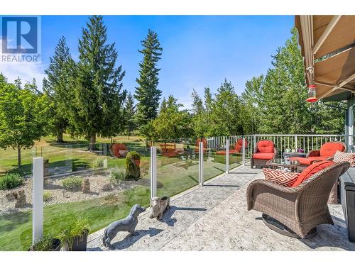 Raised deck has glass railings. - 2726 Golf Course Drive, Blind Bay, BC - Outdoor