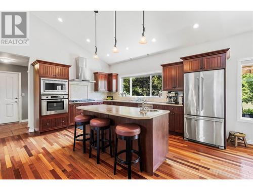 Kitchen has Island with prep sink & breakfast bar - 2726 Golf Course Drive, Blind Bay, BC - Indoor Photo Showing Kitchen With Upgraded Kitchen