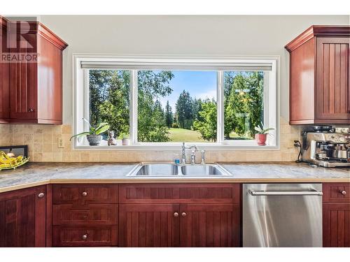 Gorgeous view of the golf course from Kitchen - 2726 Golf Course Drive, Blind Bay, BC - Indoor Photo Showing Kitchen With Double Sink