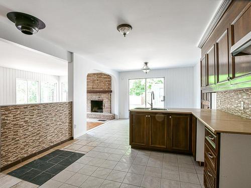 Kitchen - 5680 Ch. Des Hauteurs, Sainte-Adèle, QC - Indoor Photo Showing Kitchen With Fireplace