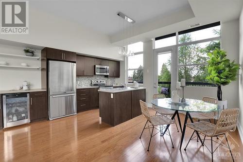 Galley kitchen includes a wine fridge and coffee 'bar' area. - 345 St Denis Street Unit#210, Ottawa, ON - Indoor