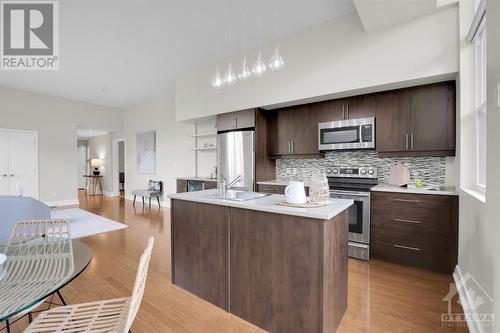 Galley Kitchen with a convenient island. - 345 St Denis Street Unit#210, Ottawa, ON - Indoor Photo Showing Kitchen With Upgraded Kitchen