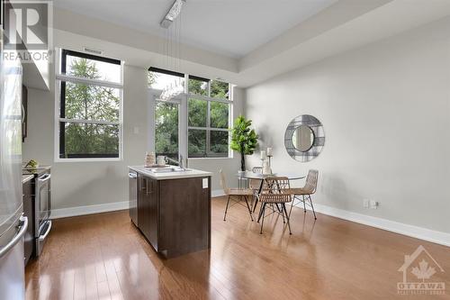 Dining area with access to the expansive balcony. - 345 St Denis Street Unit#210, Ottawa, ON - Indoor Photo Showing Other Room