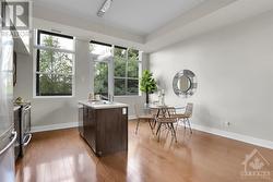 Dining area with access to the expansive balcony. - 