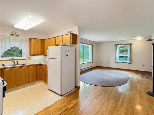 76 Centennial Drive, Onanole, MB - Indoor Photo Showing Kitchen With Double Sink